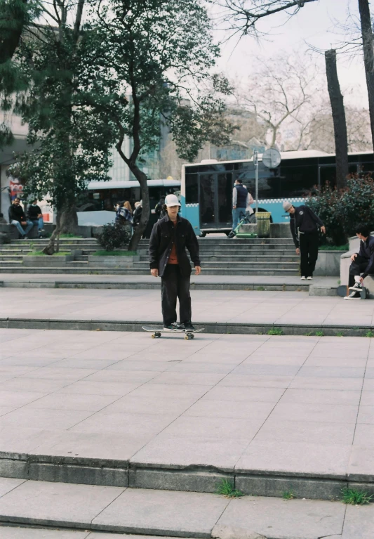 some men riding skateboards on concrete stairs