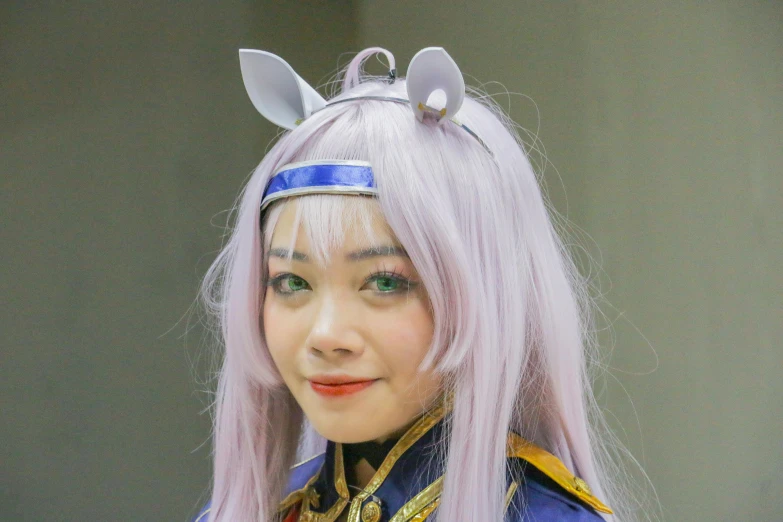 a female with pink hair in a costume