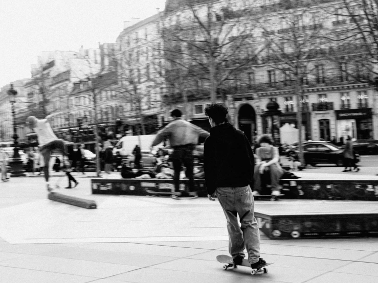 a man riding a skateboard down a street