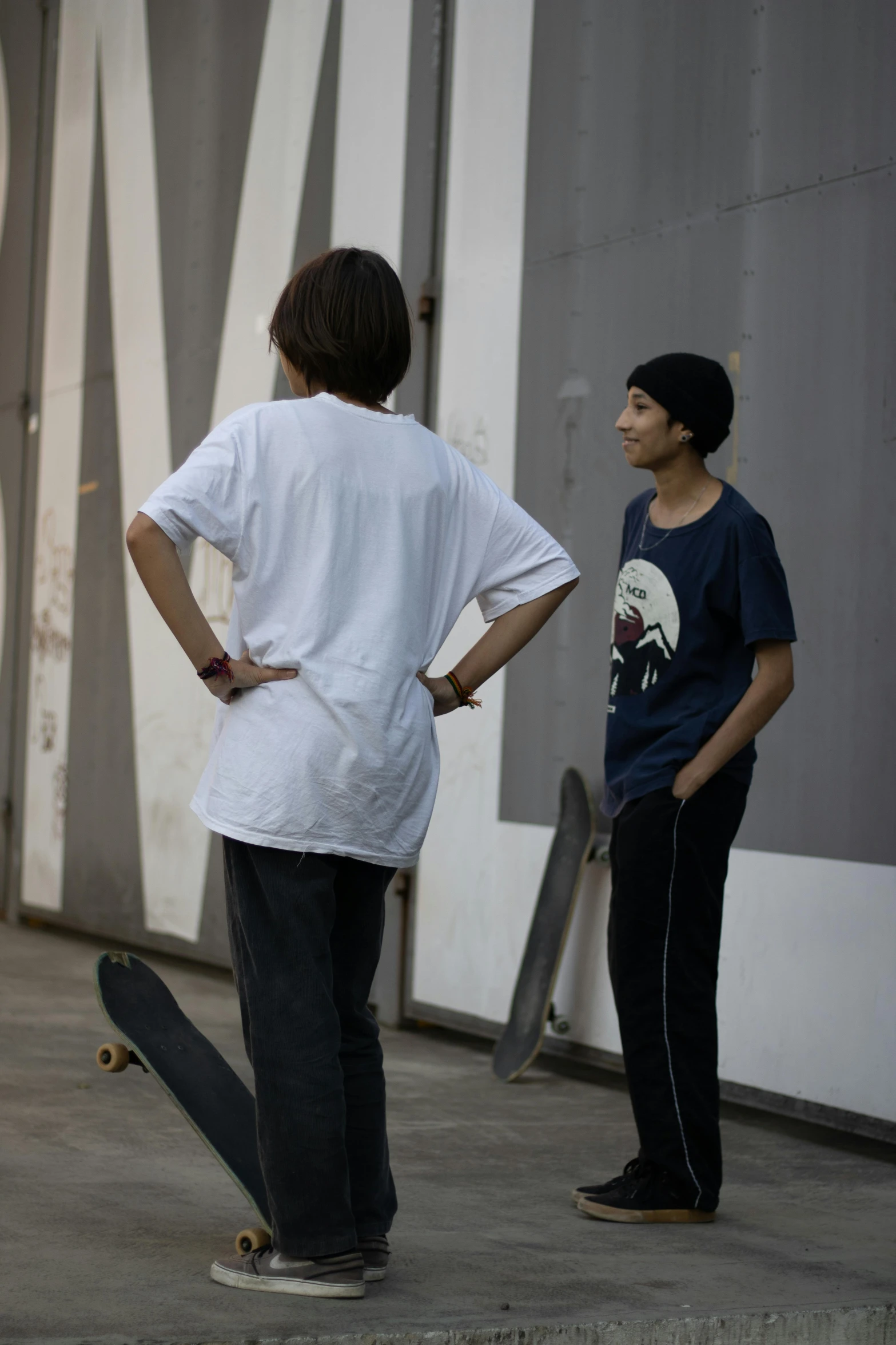 skateboarders are waiting for their turn to hit the wall