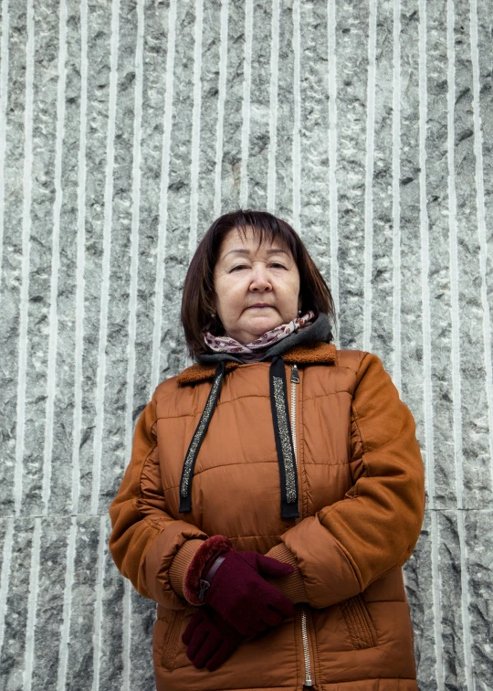 woman looking up wearing winter clothes and warm gloves