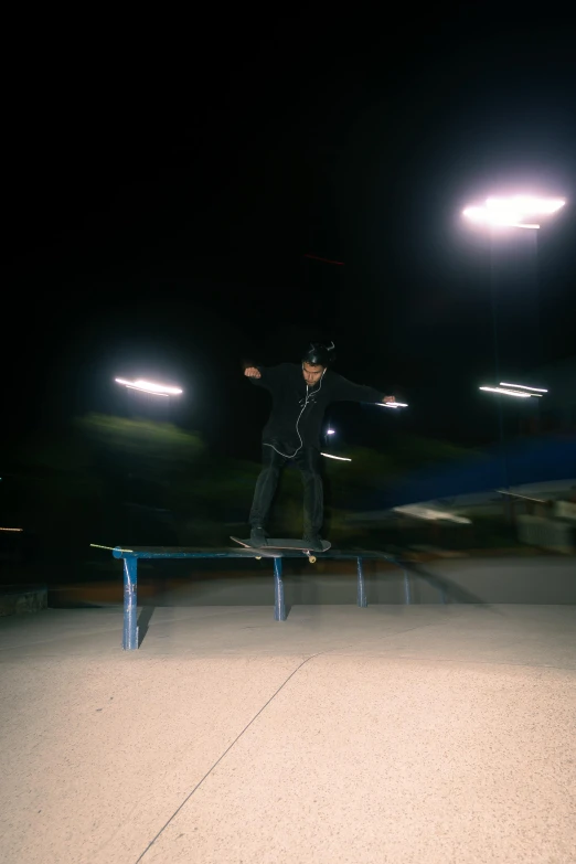 a man riding a skateboard on top of a railing