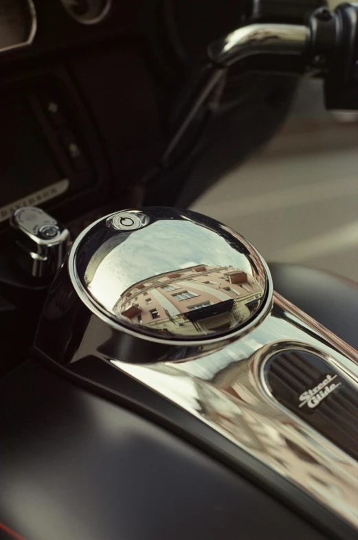 a mirror in the center of a motorcycle