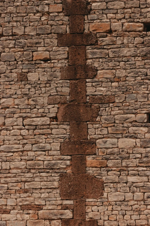 an image of a brick wall with stop sign