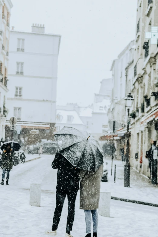 there are two people walking together under an umbrella