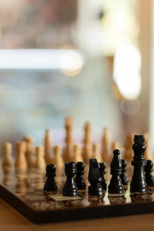 a chess set with pieces of black and white chess in the foreground