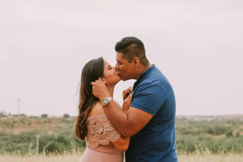 a man and woman standing next to each other