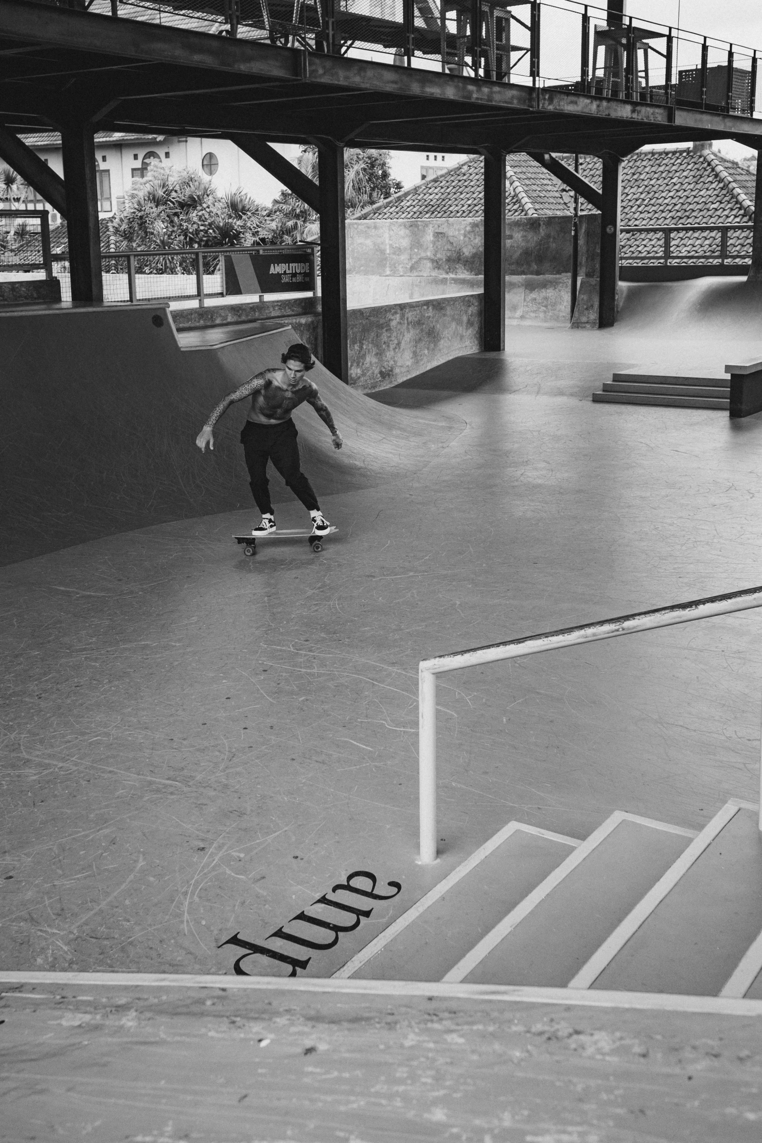 a man riding a skateboard down a ramp