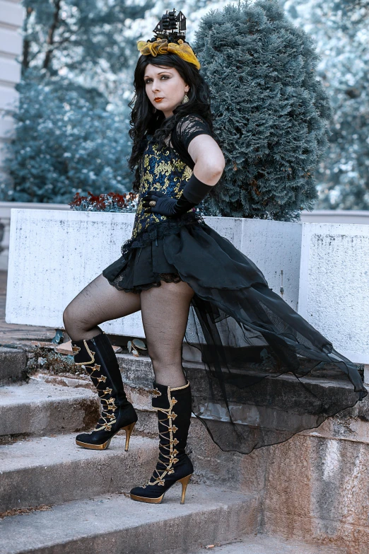 a woman is posing on some steps in high heels