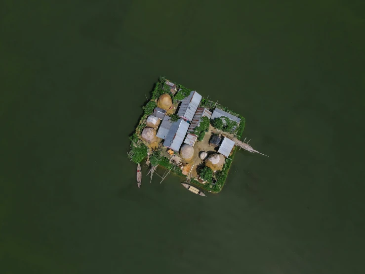 an aerial s of a house on the water