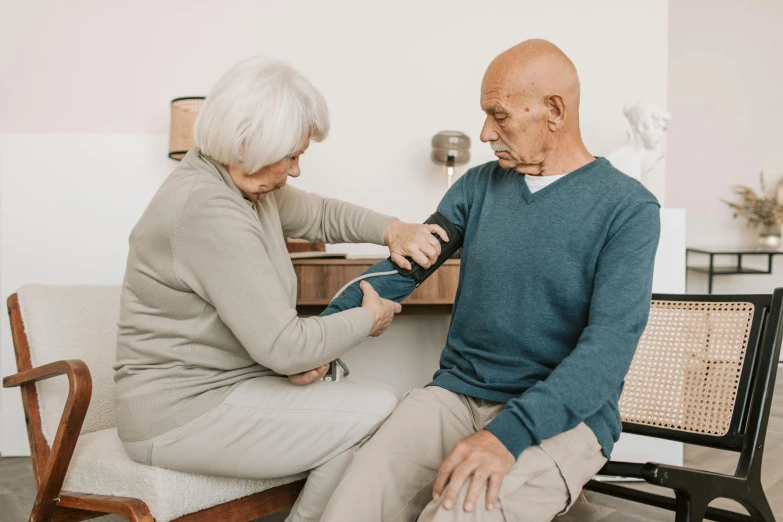 an elderly couple who is putting together ties