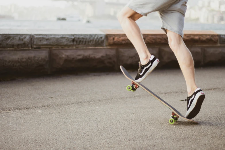 a man standing on top of a skateboard doing a trick