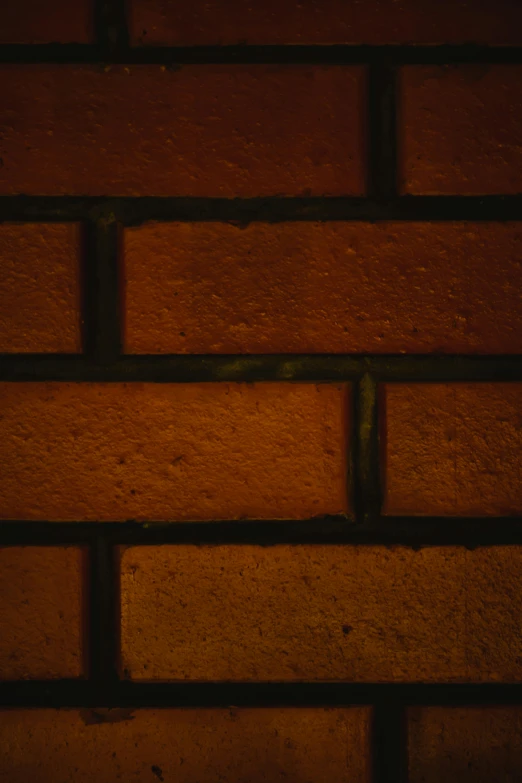 a close up of a red brick wall