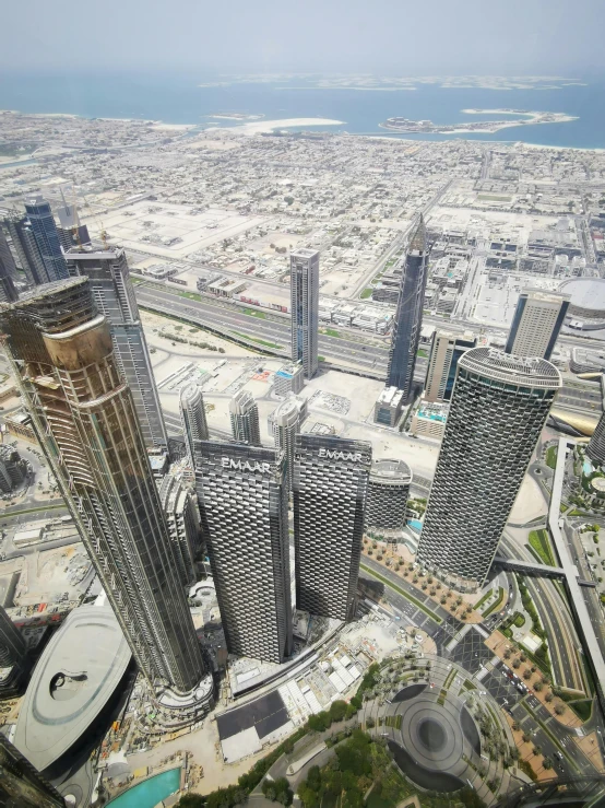 the city skyline and large buildings are pictured from high up