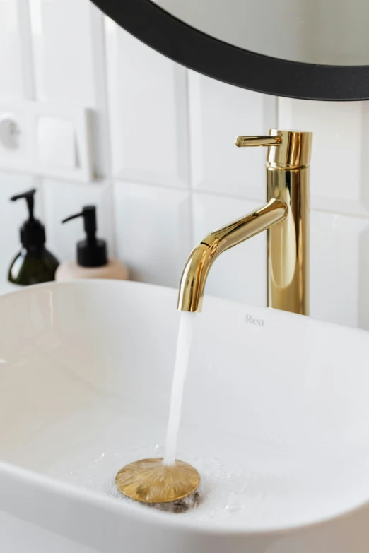 a water spout is flowing into the sink