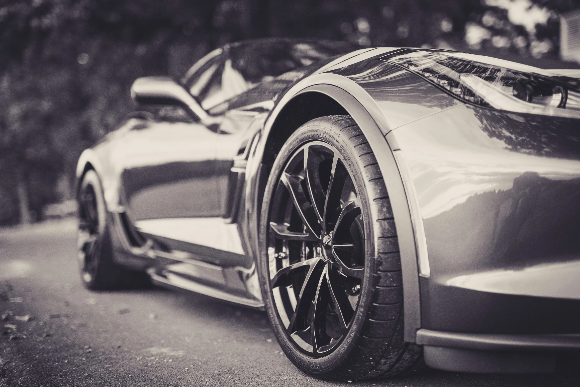 a sports car parked on the side of a road