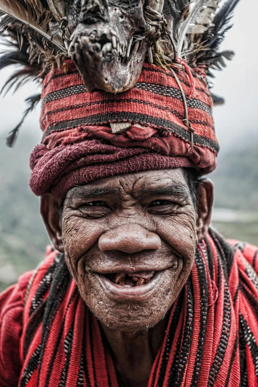 a man wearing a head band and a bird on his neck