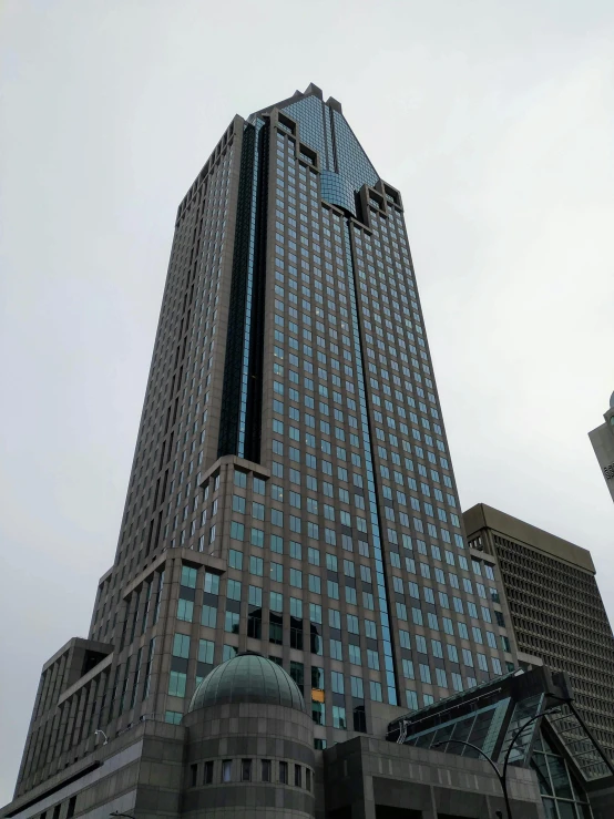 a very tall building with a clock on it's side