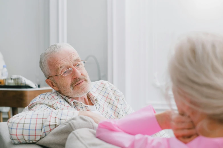 a smiling man and woman are sitting together