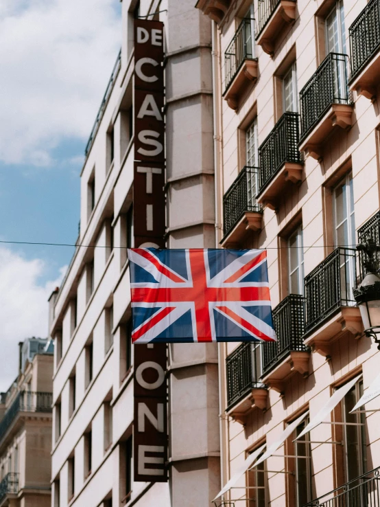 an british flag hanging from the side of a building