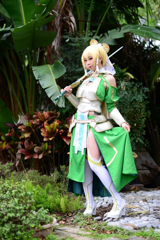 a girl in costume posing with a broom