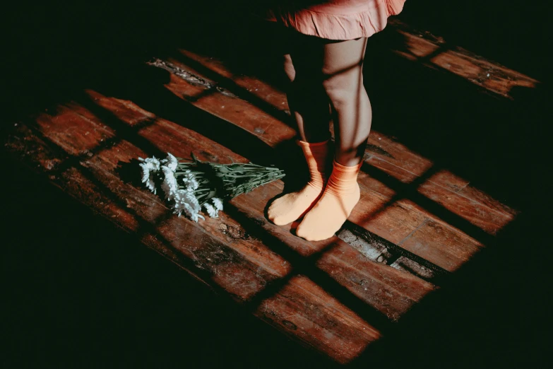 a person walking with their feet propped up on a bench