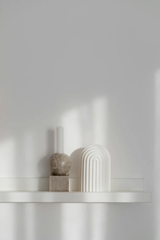 a set of stone objects sitting on a shelf