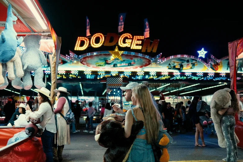 some people at an outdoor fair during the night