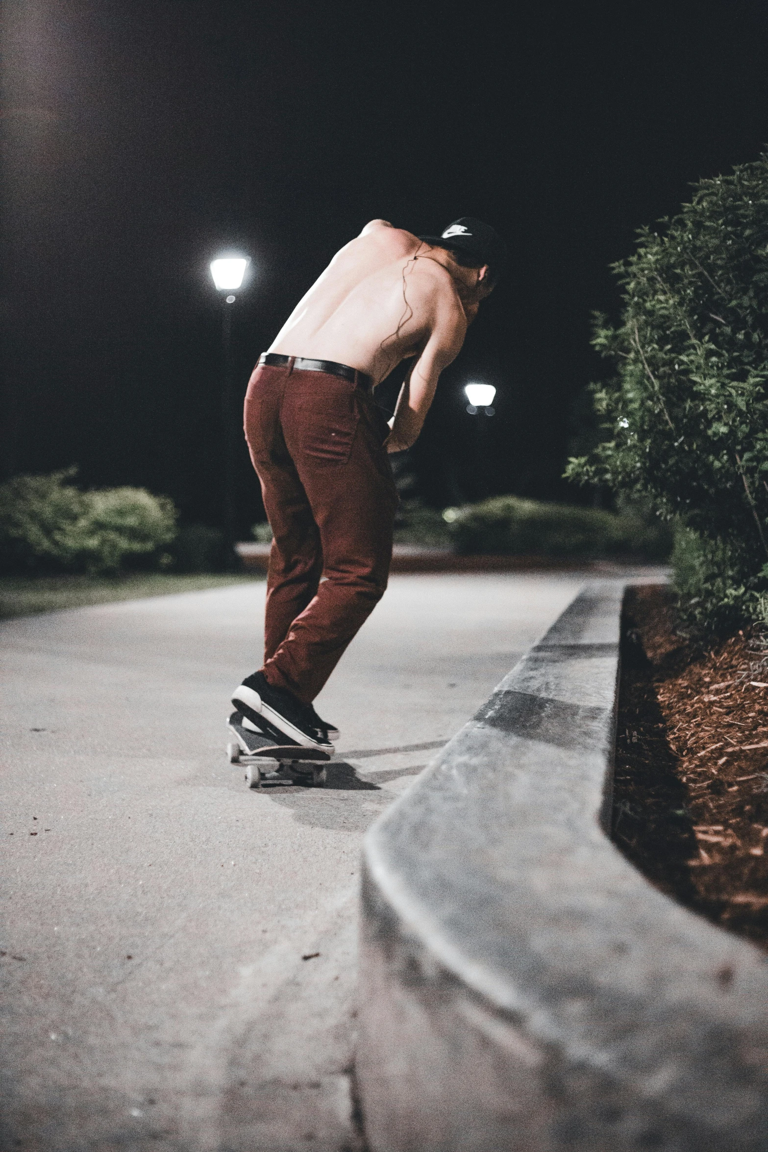 a man riding a skateboard in the night