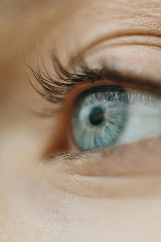 a close up of a person's blue eye