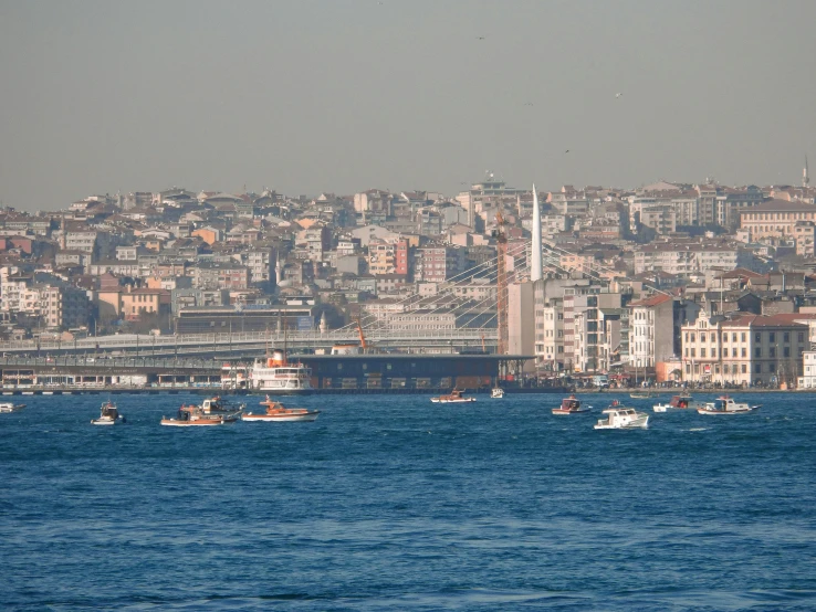 the boats are riding in the blue water