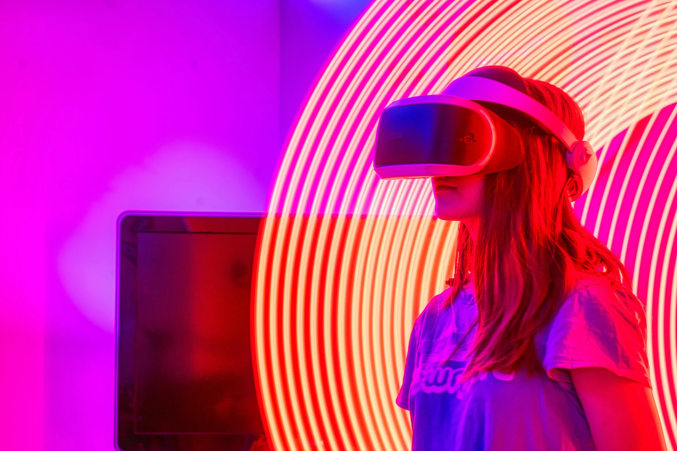 a woman with a virtual headset in a purple room