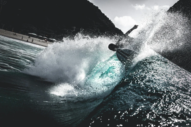 a person riding a surfboard on a wave