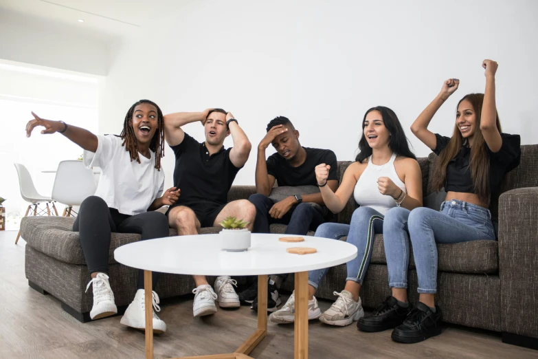 a group of people sitting on top of a couch