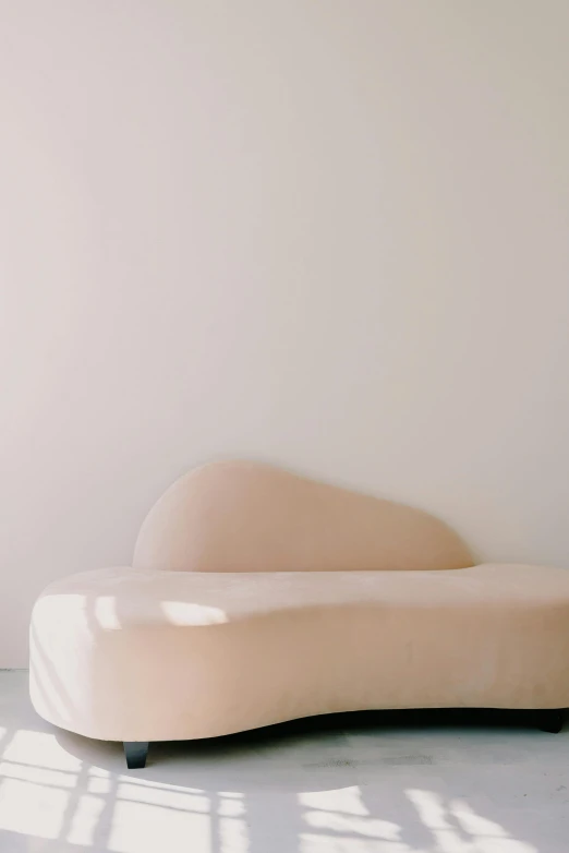 an unusual, shaped sofa that will be easily used to sleep
