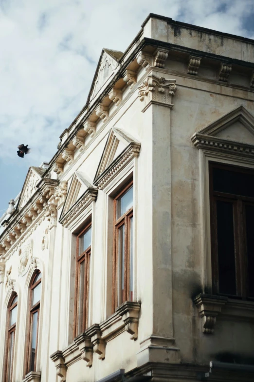 this is the corner of a building with multiple windows