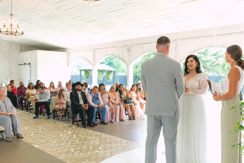 wedding couple on aisle under tent in outdoor ceremony area