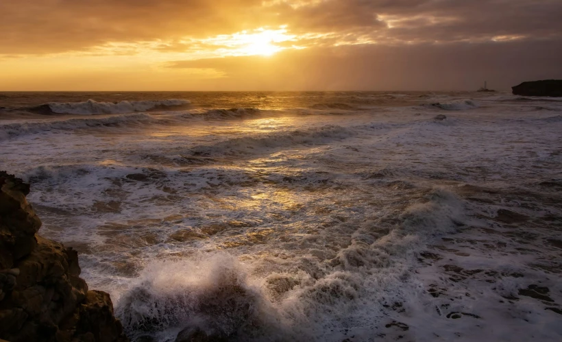 a very large body of water with waves coming in