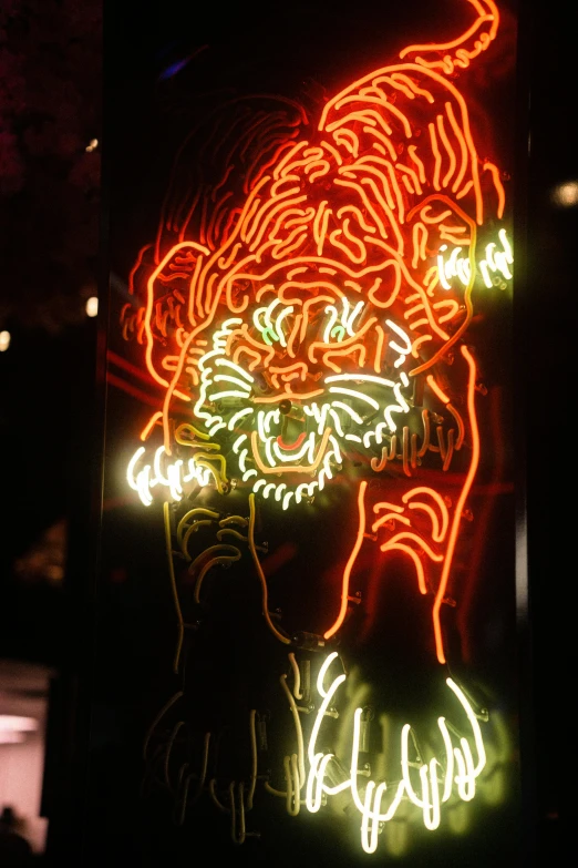 a red neon sign with several lights on it