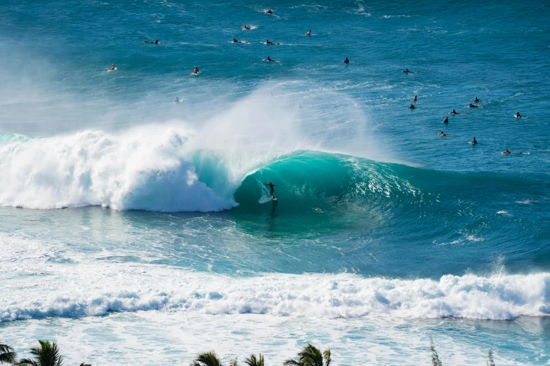 surfers are riding a wave in the ocean