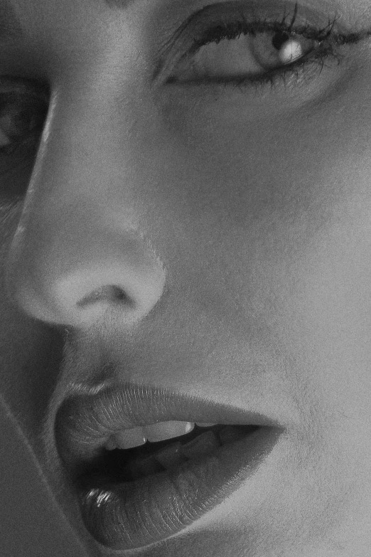 a black and white po of a woman's face