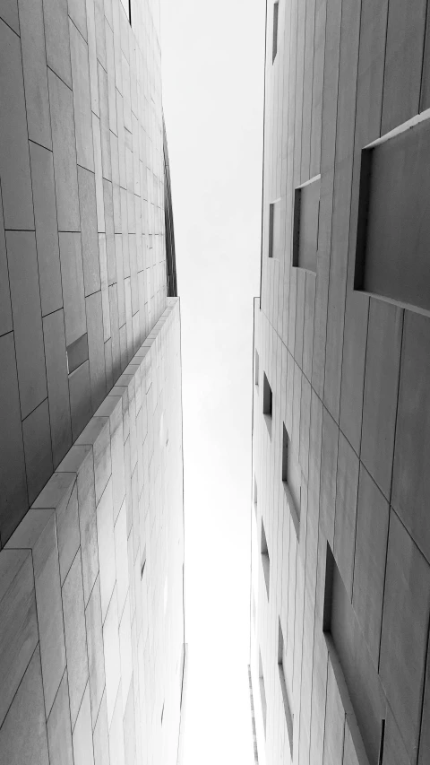 three buildings are facing away and the sky is in the background