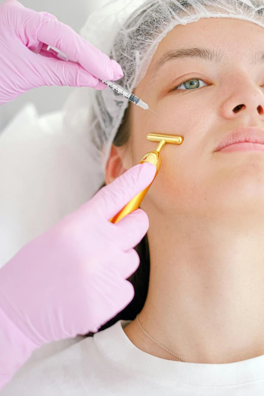 a woman sitting in a dentist chair is looking at her patient with a scissor in her hand