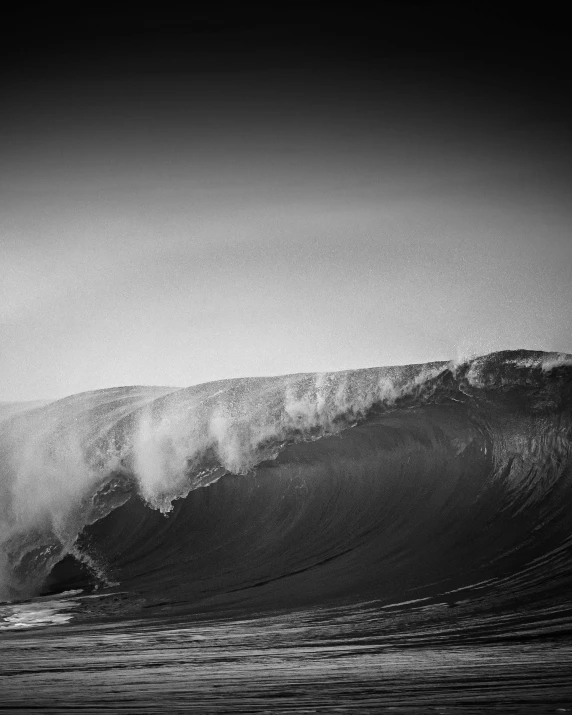 a person riding a wave in the ocean with a surfboard