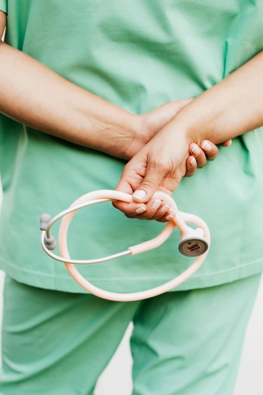 a person with a doctor's stethoscope in their hand