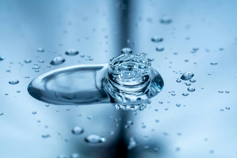 closeup of water droplets on a mirror surface