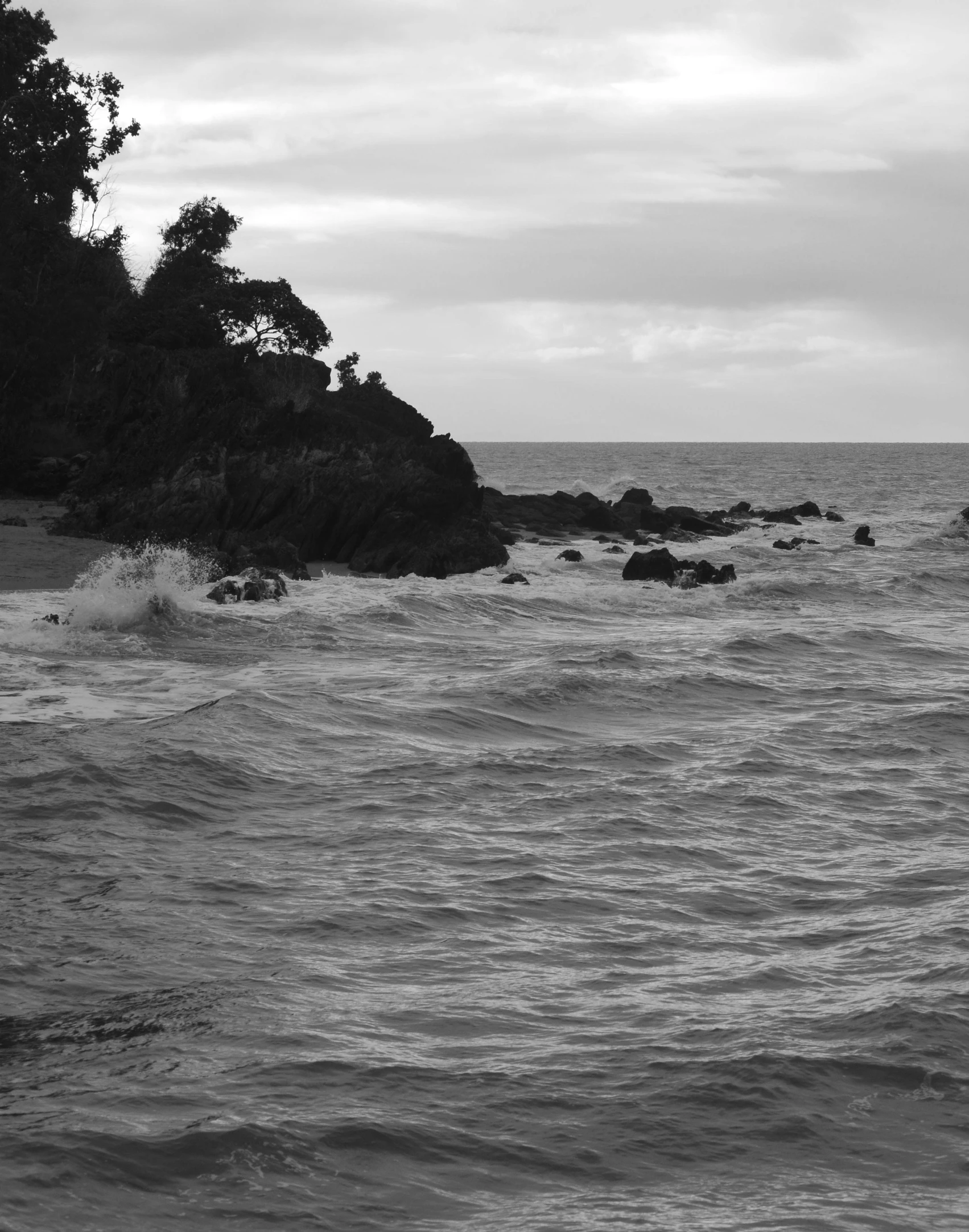 a black and white po of the ocean