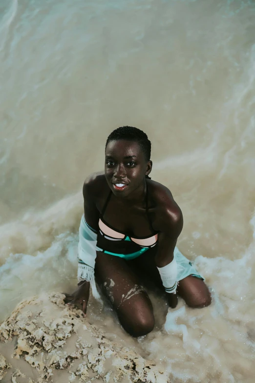 a young lady in a bikini in the water