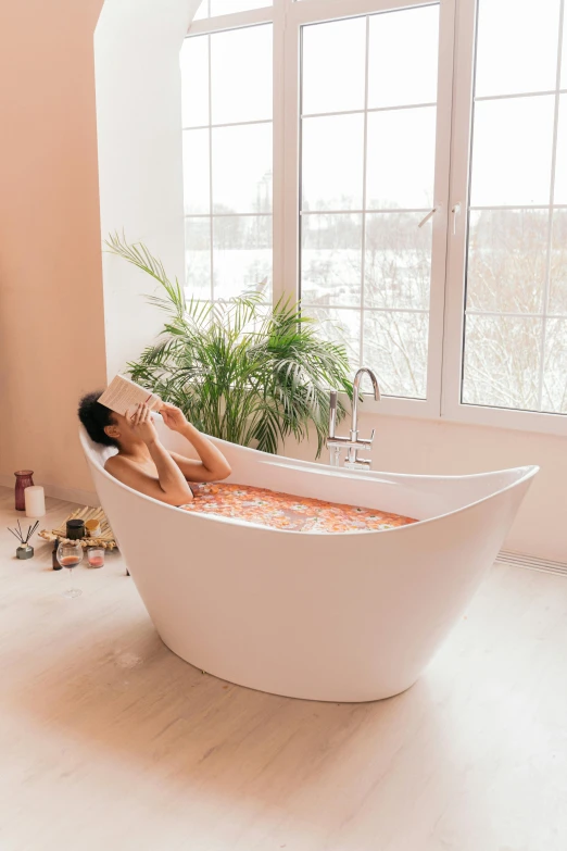 a women sitting in an elegant bathtub surrounded by toys