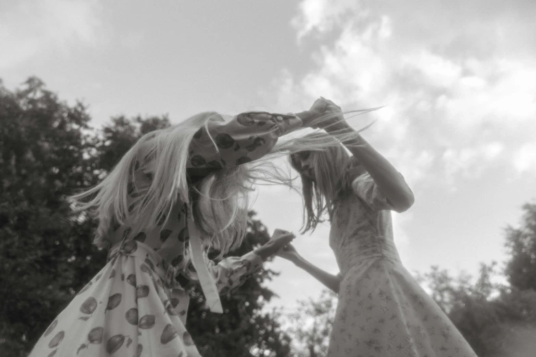 two women that are standing next to each other